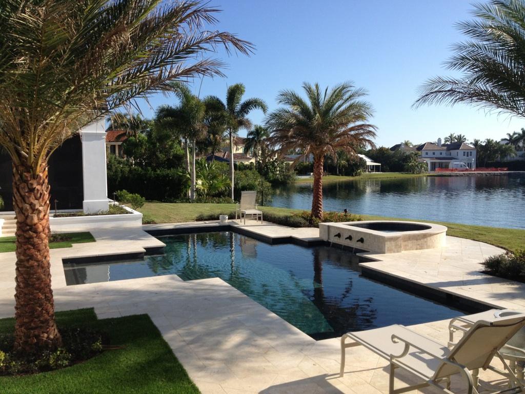 rhr pools dark interior pool and spa with water features in jupiter, fl